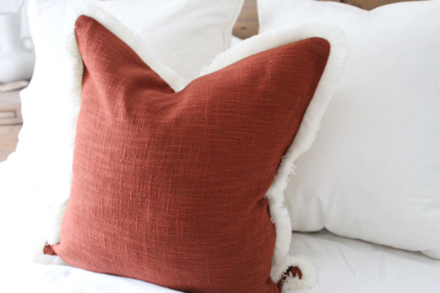 Terracotta fringed cream trim cotton cushion 45 x 45cm