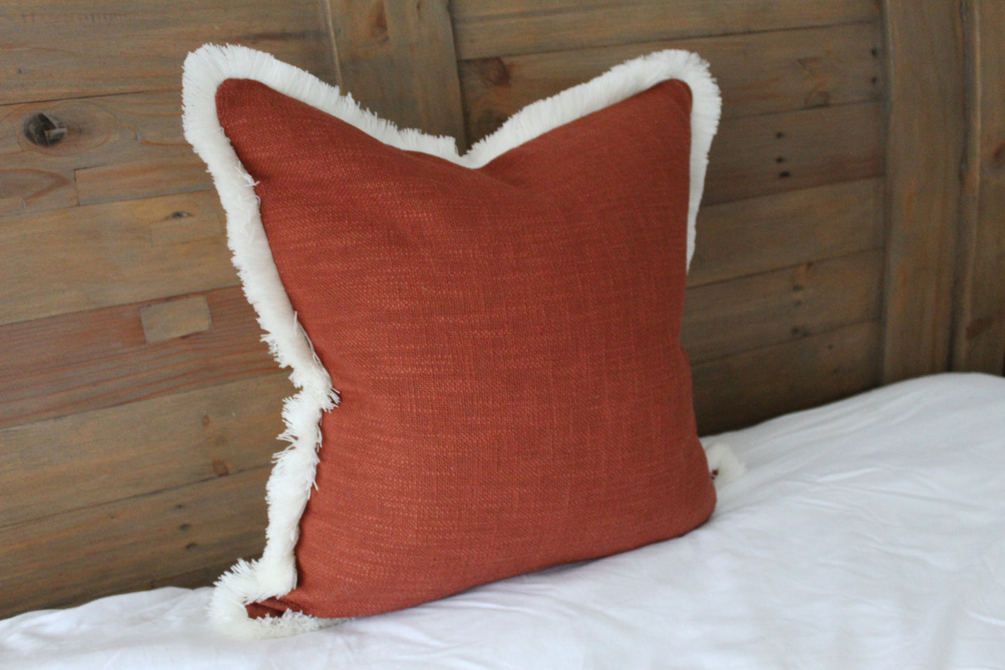 Terracotta fringed cream trim cotton cushion 45 x 45cm