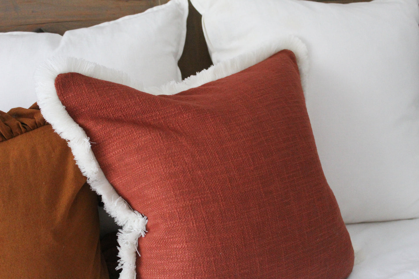 Terracotta fringed cream trim cotton cushion 45 x 45cm