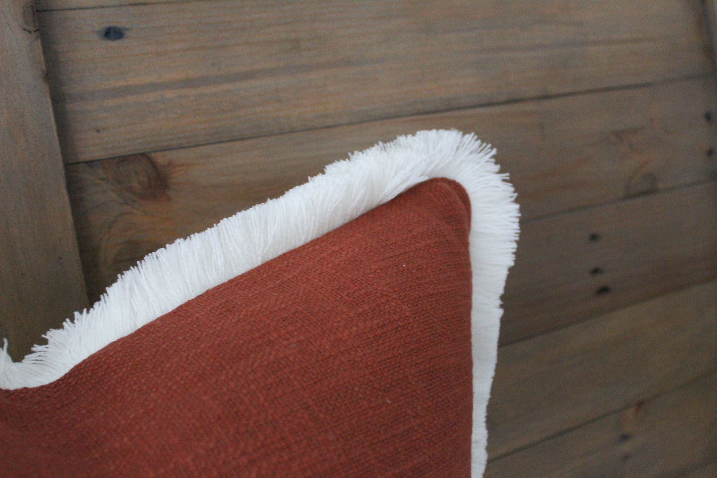 Terracotta fringed cream trim cotton cushion 45 x 45cm