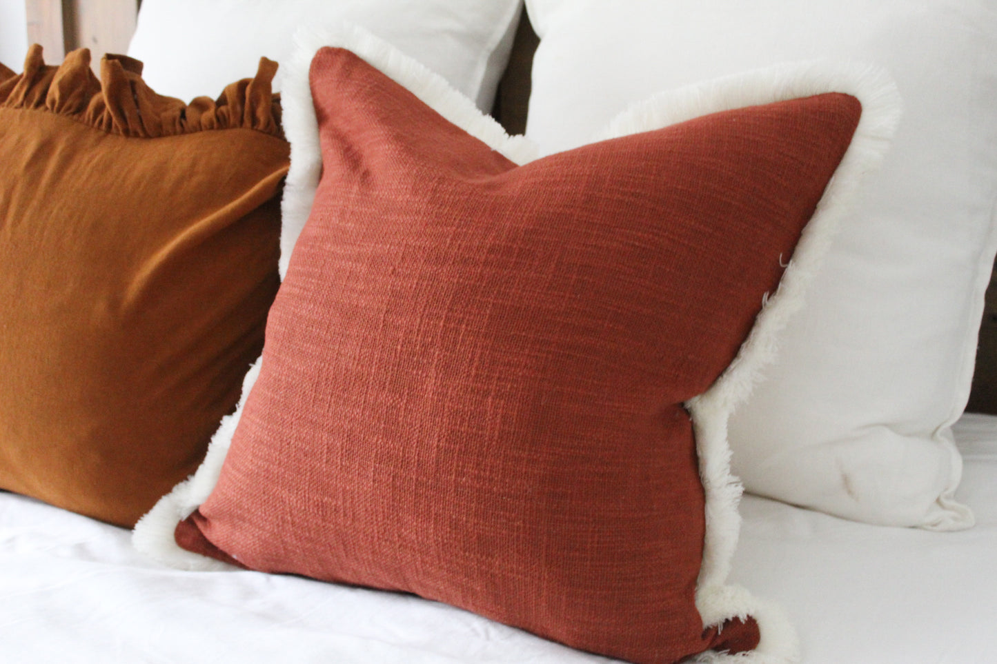 Terracotta fringed cream trim cotton cushion 45 x 45cm