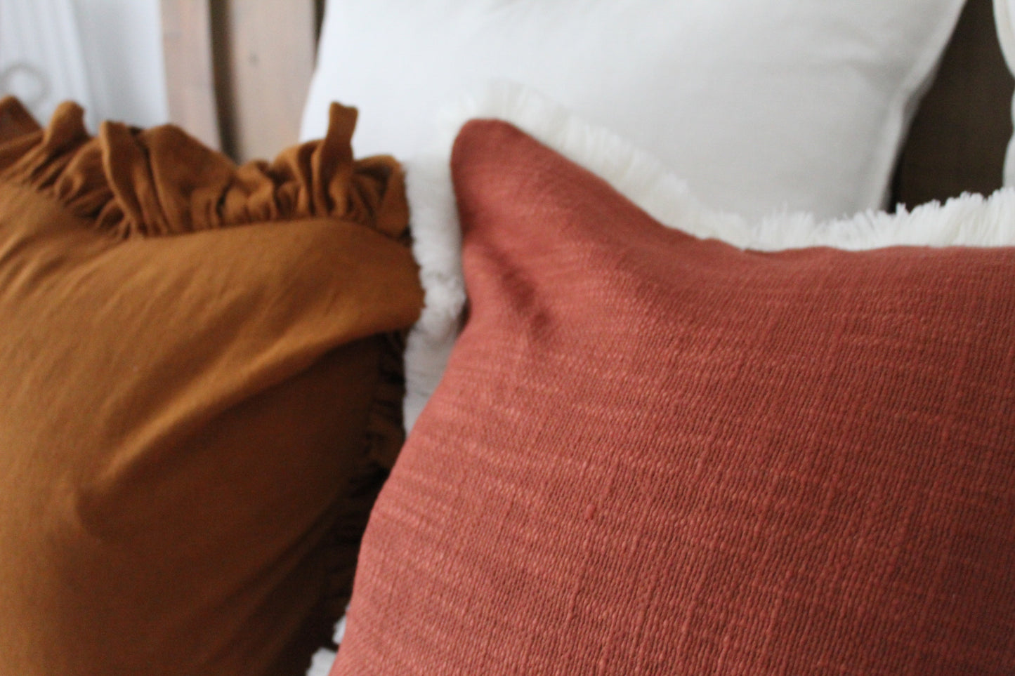 Terracotta fringed cream trim cotton cushion 45 x 45cm