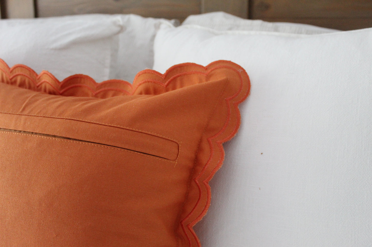 Orange scalloped edge cotton cushion with duck feather inserts 45 x 45cm