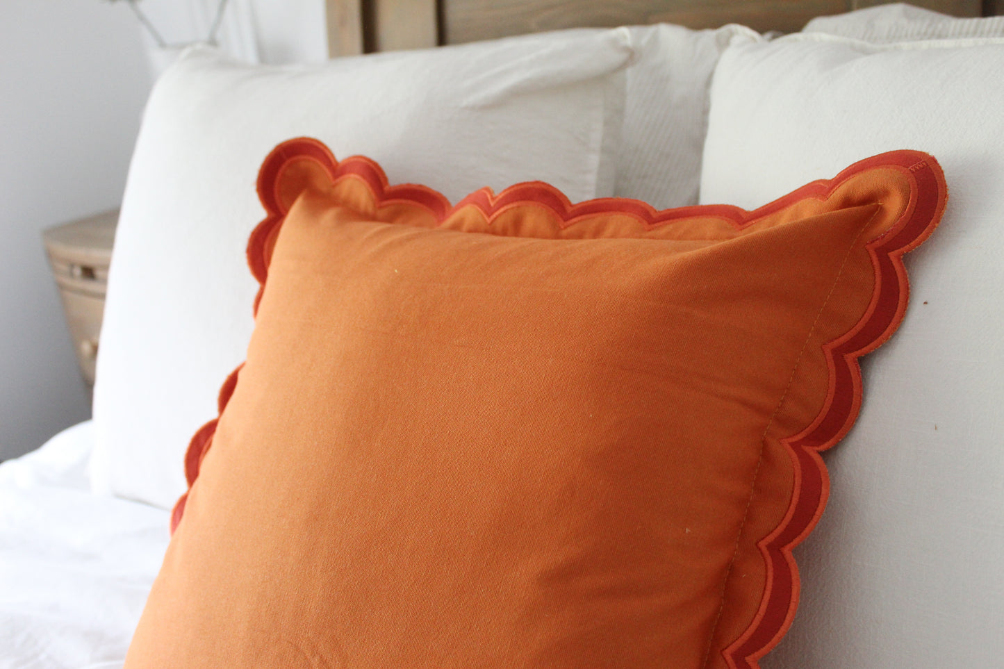 Orange scalloped edge cotton cushion with duck feather inserts 45 x 45cm